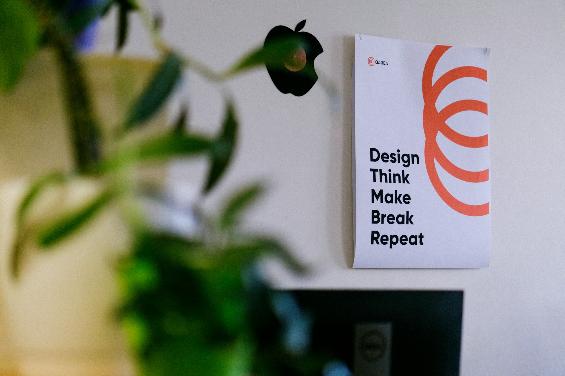 white and orange card on green plant